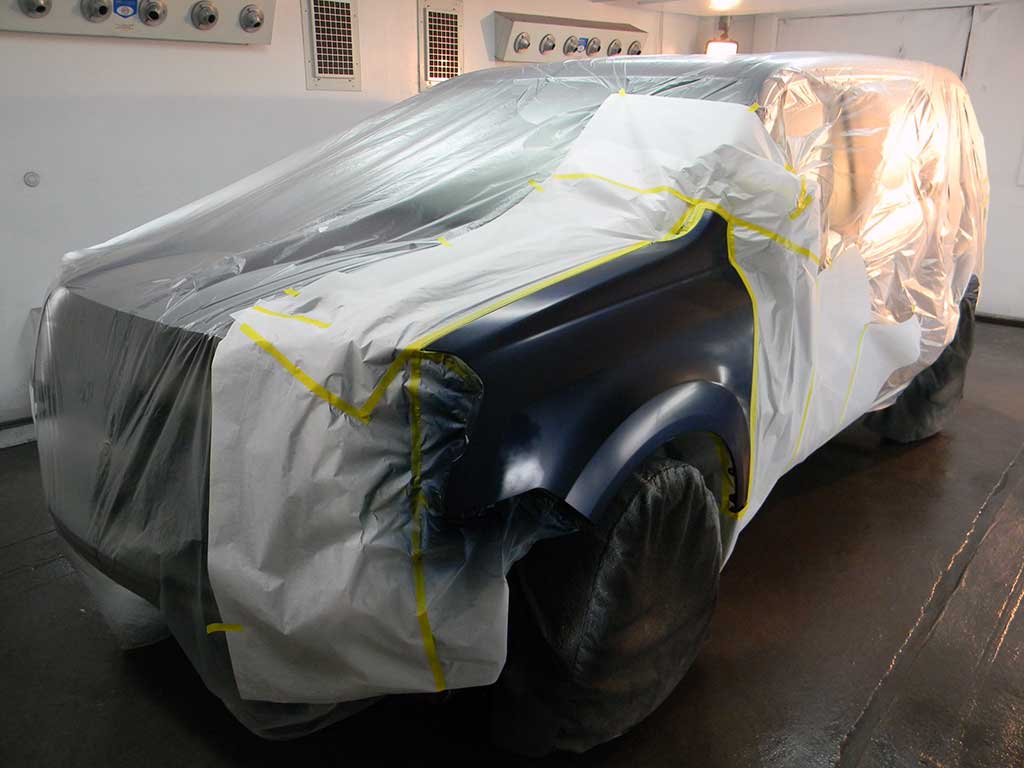 A car in the Murphy Bros. Auto Body paint booth